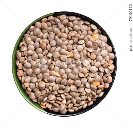 brown unhulled red lentils in round bowl isolated 79190180