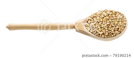 spoon with raw green buckwheat grains isolated 79190214