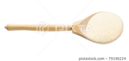 wood spoon with soft wheat manna groats isolated 79190224