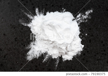 top view of pile of potato starch closeup on black top view of pile of potato starch closeup on black 79190375