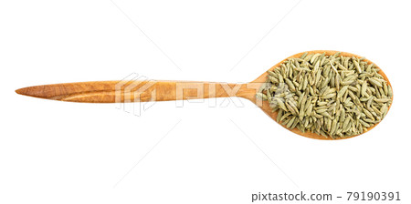 top view of wood spoon with anise seeds isolated 79190391
