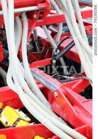 Springs and tubes are arranged in a row. A row of seeder. Heavy equipment on agricultural exhibition Springs and tubes are arranged in a row. A row of seeder. Heavy equipment on agricultural exhibition 79190566