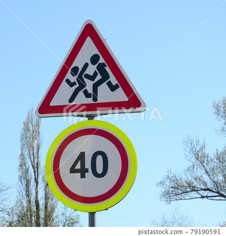 Road sign with the number 40 and the image of the children who run across the road Road sign with the number 40 and the image of the children who run across the road 79190591