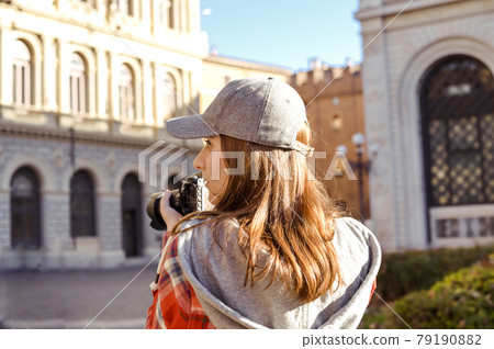 Woman traveling and taking pictures outdoors. Photographer Traveling Attractions Walk Hobby Woman traveling and taking pictures outdoors. Photographer Traveling Attractions Walk Hobby 79190882