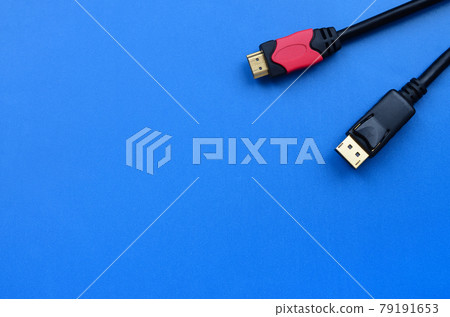 Audio video HDMI computer cable plug and 20-pin male DisplayPort gold plated connector for a flawless connection on a blue background 79191653