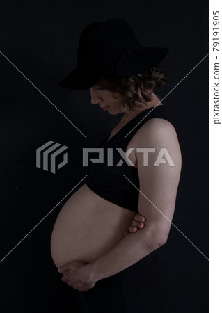 Pregnant caucasian woman dreaming about her baby. Pregnant caucasian woman dreaming about her baby. 79191905