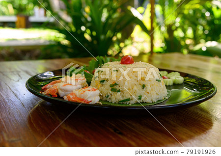 Fried rice with shrimp on black dish Fried rice with shrimp on black dish 79191926