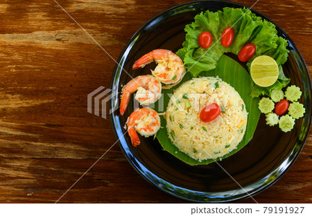 Top view of fried rice with shrimp on black dish Top view of fried rice with shrimp on black dish 79191927