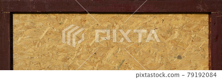 OSB boards are made of brown wood chips sanded into a wooden background OSB boards are made of brown wood chips sanded into a wooden background 79192084