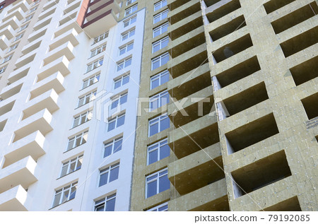 Residential multi store apartement building house facade under construction Residential multi store apartement building house facade under construction 79192085