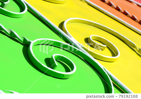 Metal texture of a piece of colored wall with a forged pattern 79192108