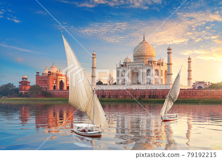 Famous Taj Mahal complex, the Yamuna river and boats, beautiful sunset, Agra, India Famous Taj Mahal complex, the Yamuna river and boats, beautiful sunset, Agra, India 79192215