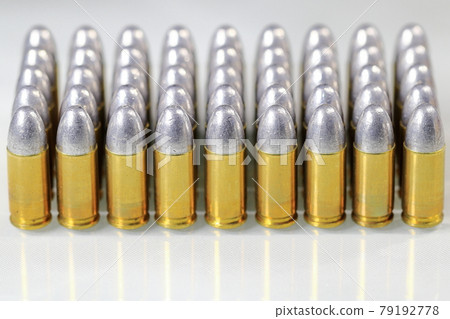 pack of bullet 9mm parabellum LRN ( lead round nose ) isolate on white background reflection surface. pack of bullet 9mm parabellum LRN ( lead round nose ) isolate on white background reflection surface. 79192778