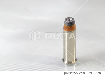 close up The .38 Special Semi Jacketed Hollow Point bullet on reflection surface. 79192783