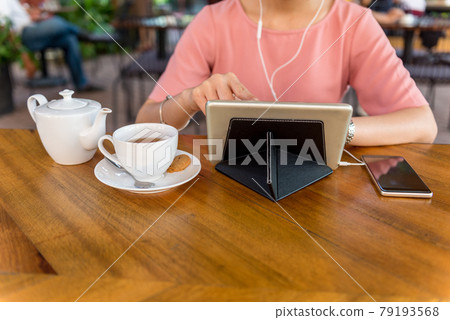 Woman using tablet and surfing information Woman using tablet and surfing information 79193568