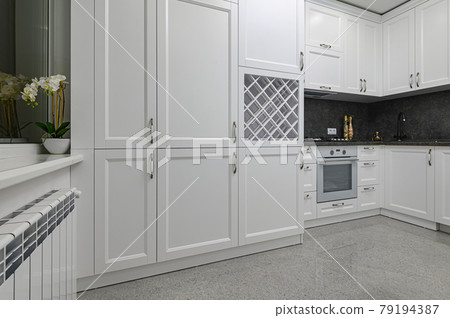 Luxury well designed modern black and white kitchen Luxury well designed modern black and white kitchen 79194387