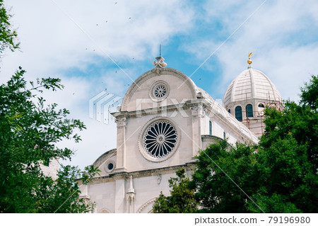 View of the Cathedral of St. James in Sibenik, Croatia against the background of blue sky and green trees View of the Cathedral of St. James in Sibenik, Croatia against the background of blue sky and green trees 79196980