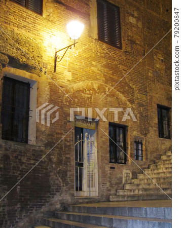 Italy / Siena Brick building with street lights and stairs Night townscape Italy / Siena Brick building with street lights and stairs Night townscape 79200847