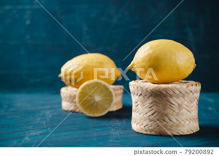 Fresh lemon on dark green color background Fresh lemon on dark green color background 79200892