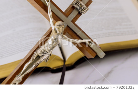 Jesus on way to God through prayer Holy Bible and the crucifix 79201322