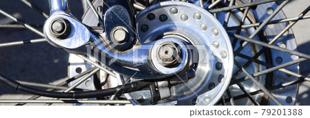 Fragment of chromed shiny wheel of old classic motorbike 79201388