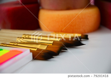 Color cosmetics, brushes and sponges for face painting on white background 79201418