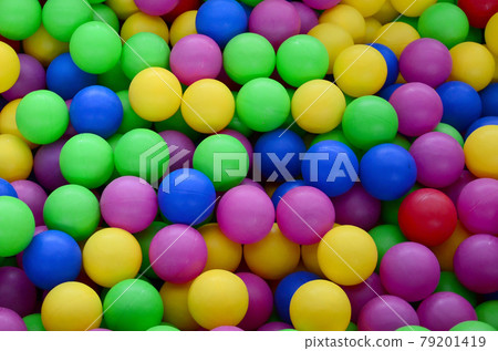 Swimming pool for fun and jumping in colored plastic balls Swimming pool for fun and jumping in colored plastic balls 79201419