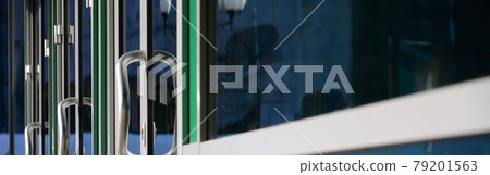 Chrome door handle and glass of modern aluminium office facade Chrome door handle and glass of modern aluminium office facade 79201563