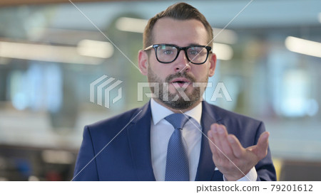 Portrait of Middle Aged Businessman Feeling Shocked  79201612