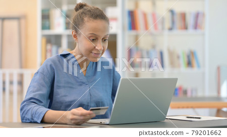 Online Payment Success on Laptop for African Woman in Library Online Payment Success on Laptop for African Woman in Library 79201662