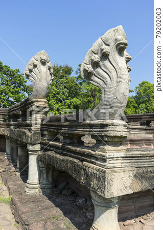 Seven Headed Naga Sculptures under Vivid Blue Sky at the Entrance of Phimai Historical Park in Nakhon Ratchasima, Thailand. 79202003
