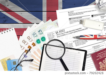 English form LLAD02 Notification of single alternative inspection location SAIL of a limited liability partnership LLP from Companies House service lies on table English form LLAD02 Notification of single alternative inspection location SAIL of a limited liability partnership LLP from Companies House service lies on table 79202428