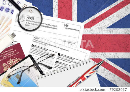 English form AD03 Change of location of the company records to the single alternative inspection location SAIL from Companies House service lies on table with office items English form AD03 Change of location of the company records to the single alternative inspection location SAIL from Companies House service lies on table with office items 79202457