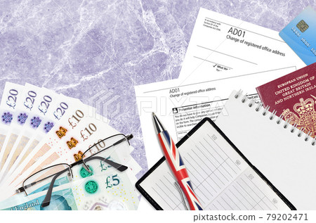 English form AD01 Change of registered office address from Companies House service lies on table with office items. CH business and paperwork process in United Kingdom English form AD01 Change of registered office address from Companies House service lies on table with office items. CH business and paperwork process in United Kingdom 79202471
