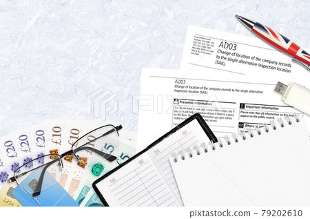 English form AD03 Change of location of the company records to the single alternative inspection location SAIL from Companies House service lies on table with office items English form AD03 Change of location of the company records to the single alternative inspection location SAIL from Companies House service lies on table with office items 79202610