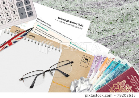 English Tax form sa103 Self-employment from HM revenue and customs lies on table with office items. HMRC paperwork and tax paying process in United Kingdom English Tax form sa103 Self-employment from HM revenue and customs lies on table with office items. HMRC paperwork and tax paying process in United Kingdom 79202613