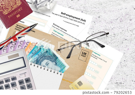 English Tax form sa103 Self-employment from HM revenue and customs lies on table with office items. HMRC paperwork and tax paying process in United Kingdom English Tax form sa103 Self-employment from HM revenue and customs lies on table with office items. HMRC paperwork and tax paying process in United Kingdom 79202653