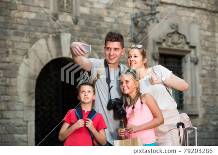 Cheerful family is traveling together, taking selfie Cheerful family is traveling together, taking selfie 79203286