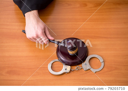 Young male judge working in the courtroom Young male judge working in the courtroom 79203710