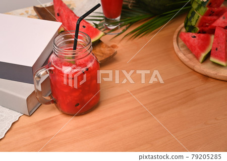 Watermelon smoothie on wooden table. 79205285