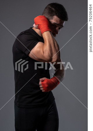 Mixed martial arts fighter working out defensive tactics 79206464
