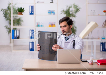 Young male doctor radiologist working in the clinic 79207351