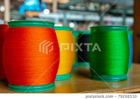 Colorful silk thread on a loom 79208310