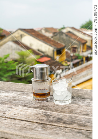 Traditional Vietnamese milk coffee on top of old town Traditional Vietnamese milk coffee on top of old town 79209472