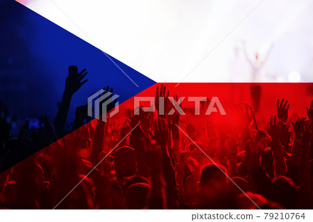 football fans supporting Czech Republic - crowd celebrating in stadium with raised hands against Czech Republic flag 79210764