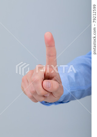 Midsection of caucasian businessman touching virtual interface, isolated on grey background 79212599