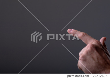 Midsection of caucasian businessman touching virtual interface, isolated on grey background 79212606