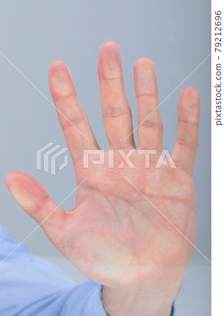 Close up of caucasian businessman touching virtual interface, isolated on grey background 79212696