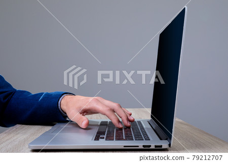 Midsection of caucasian businessman typing on keyboard, isolated on grey background 79212707
