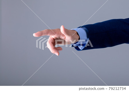 Midsection of caucasian businessman touching virtual interface, isolated on grey background 79212734